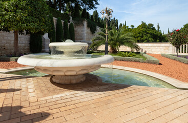 Decorative stone fountain on the territory of the Bahai Garden, located on Mount Carmel in the city...