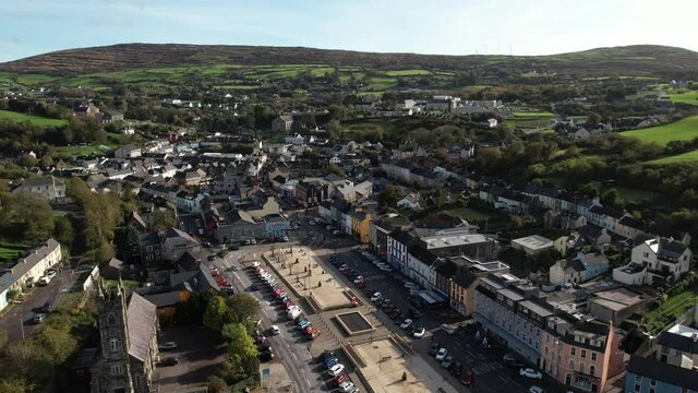 Bantry, Ireland. Aerial View of Small Coastal Town, Street Traffic and Buildings on Sunny Day, Establishing Drone Shot