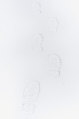 Human footprints in the snow. Snow drifts. 
