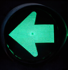 Green traffic light with green arrow light up.  Turn left