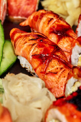 Closeup of nigirizushi with seared salmon and unagi sauce served in sushi set
