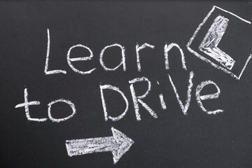 Fototapeta premium Driving school chalkboard, Educational and Creative composition with the Learn to drive caption