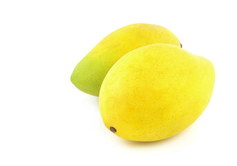 Two ripe yellow mango fruits isolated on white