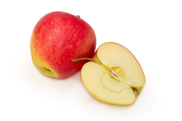 One whole and half of the red with yellow apples