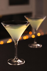 Two cocktails in martini glasses