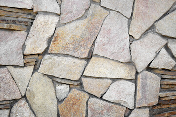 Obraz premium The light brown stone wall texture. Background.