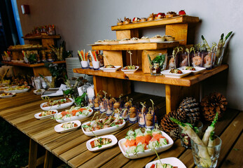 appetizer table festive food sandwiches buffet tiers