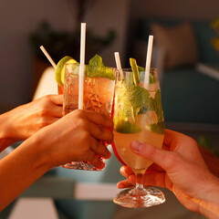 a group of people enjoying cocktail party with cheers hands