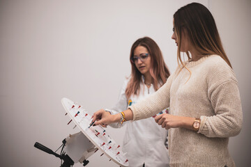 a girl undergoes vision therapy in an optician.
