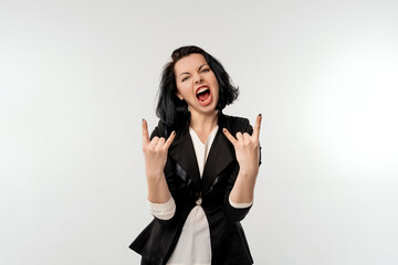 Young beautiful woman wearing black formal jacket white shirt over white background shouting with...