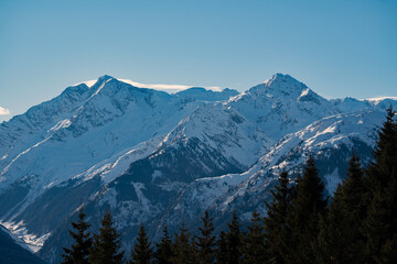 Obraz premium beautiful view of the snow capped hohe tauern in austria at a sunny winter day in december