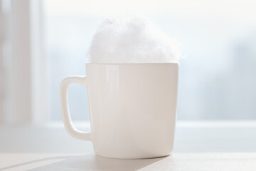 Milk foam filled with white mugs.