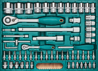 Ratchet with many attachments in plastic case. Work tools. Universal tool set