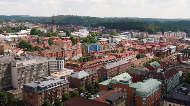 Downtown buildings of Swedish town Bor&aring;s, aerial fly forward view