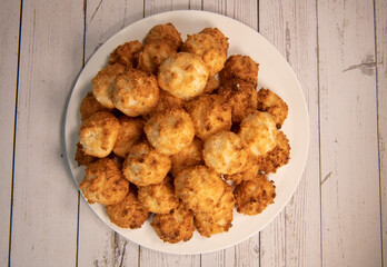 Rocher coco from coconut dessert in brown color make with white eggs and sugar
