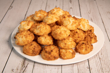 Rocher coco from coconut dessert in brown color make with white eggs and sugar