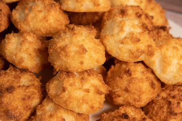 Rocher coco from coconut dessert in brown color make with white eggs and sugar