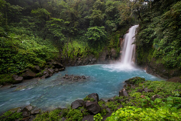 Naklejka na ściany i meble Waterfall, blue lagoon in the jungle