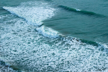 Large wave splashing in blue sea