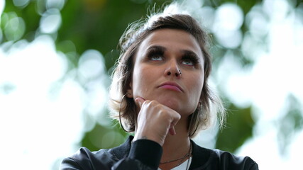 Person pondering solution close-up face thinking deeply about solution