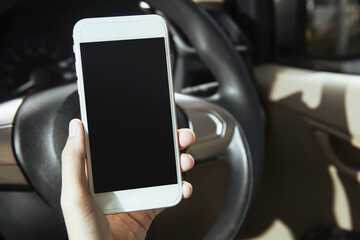 Woman hand holding a mobile phone