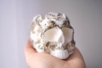 small skull shaped candle, handmade candle. Selective focus.