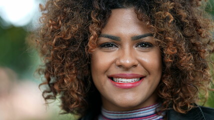 Happy Brazilian woman smiling at camera close-up face, diverse person