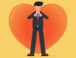 Support and care. standing business man showing heart sign with his hands expressing his love
