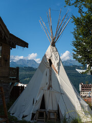 Homemade tent like an Indian stands on Rosa Khutor Against the backdrop of beautiful mountains