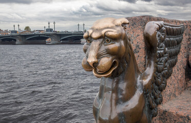 Fototapeta na wymiar Bronze griffin in St. Petersburg on the Neva River in Russia