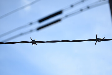 barbed wire against sky