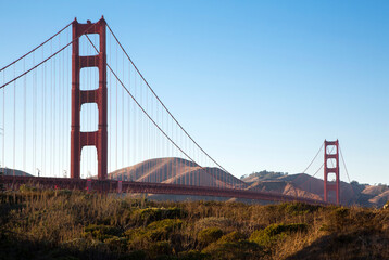 Golden Gate Bridge against the blue sky and mountains