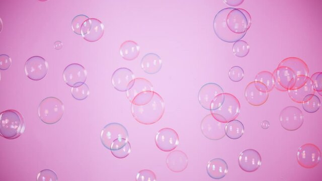 Super Slow Motion Shot of Flying Colorful Soap Bubbles on Pink Background at 1000 fps.