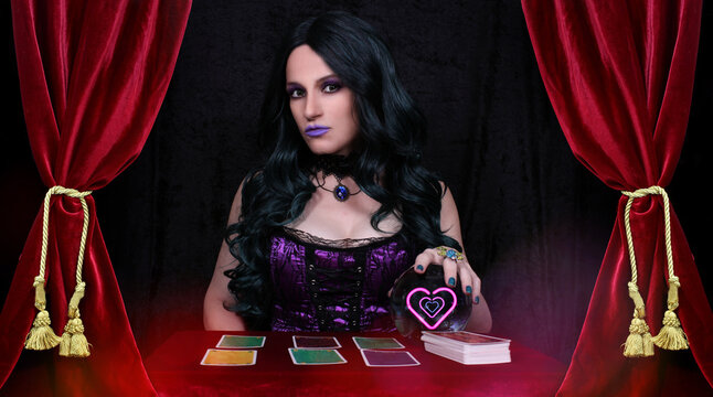 Psychic with Crystal Ball and tarot cards in Red Velvet Tent