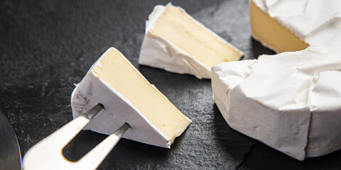 camembert or brie soft cheese food snack on the table copy space food background rustic 