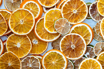 Obraz premium dried citrus fruits, dried oranges close-up view, macro photo, space for text, blank for design, background image of dried oranges, tinted image