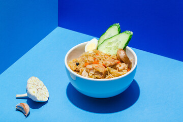 Traditional Uzbek oriental cuisine rice with meat plov on blue hair shadow modern style.
