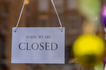 Lockdown, Sign board hanging in front door with a word 
