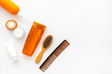 Hair care set of cosmetic products with shampoo and comb. 