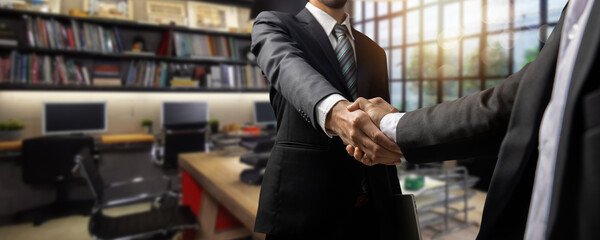 successful negotiate and handshake concept, two businessman shake hand with partner to celebration partnership and teamwork in office, business deal	