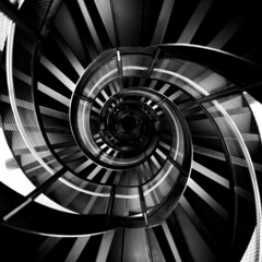 Grayscale shot of a spiral staircase abstraction
