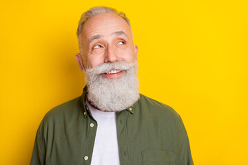 Photo portrait of senior man smiling dreamy cheerful curious looking copyspace isolated on bright...