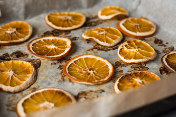 Dried orange oranges from the oven. Fragrant citrus slices for decoration.