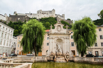 Beautiful chapter fountain and the Hohensalzburg fortress in Salzburg