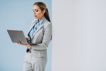 Young business woman standing in the office isolated