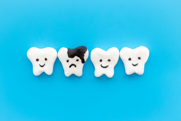 Teeth health and dental care. Teeth models with caries or plaque