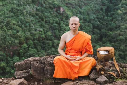 Monk meditating on top of a mountain, Purify the mind.