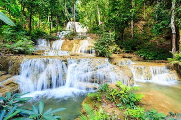 Keuken spatwand met foto Mae Kae Waterfall is Unseen waterfall at Tham Pha Thai national park, Lampang province, jungle Thailand. © CHARAN