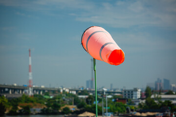 Windsock indicator of wind on tank chemical cone indicating wind direction and force. Horizontally...
