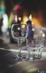 table in a restaurant with white tablecloth and empty glasses